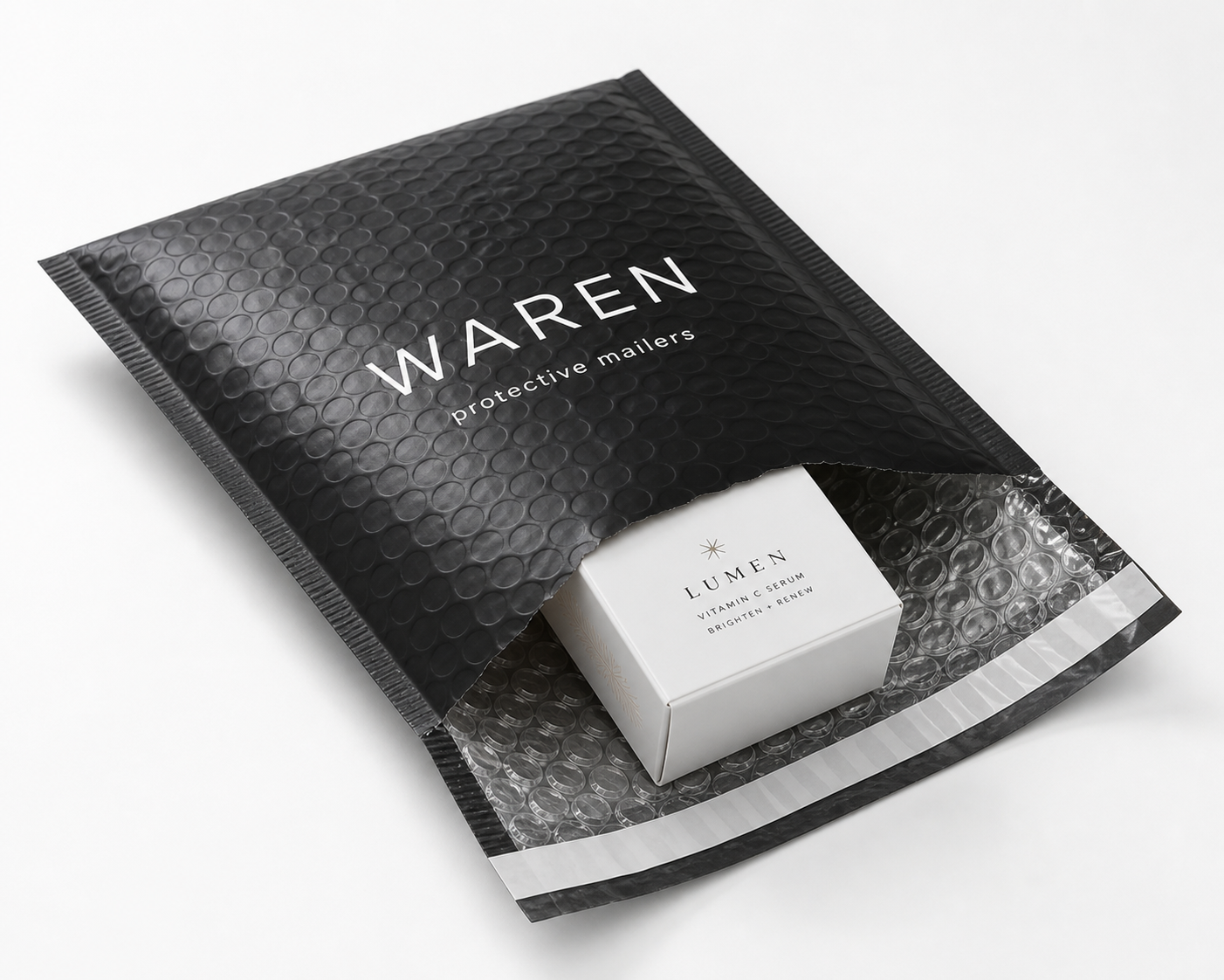 Custom bubble mailer with logo opened to show bubble padding and self sealing adhesive strip