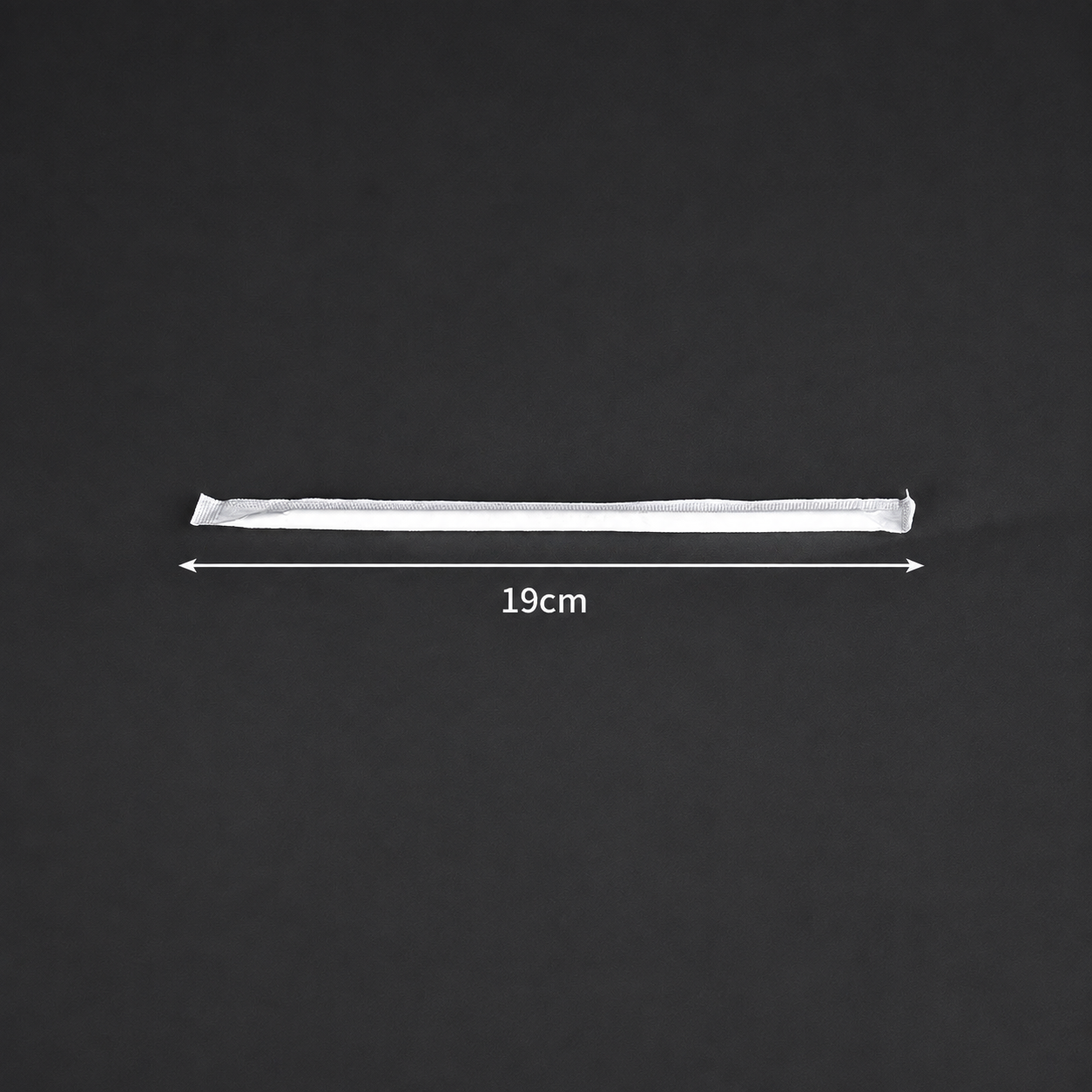 19 cm long x 6 mm diameter PLA straw in an individual wrapper, size reference.
