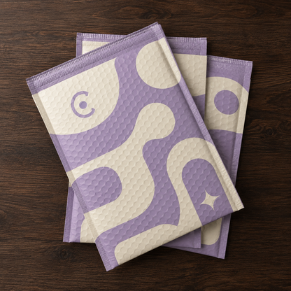Purple custom matte bubble mailers with patterned logo print for retail and ecommerce shipping bags.