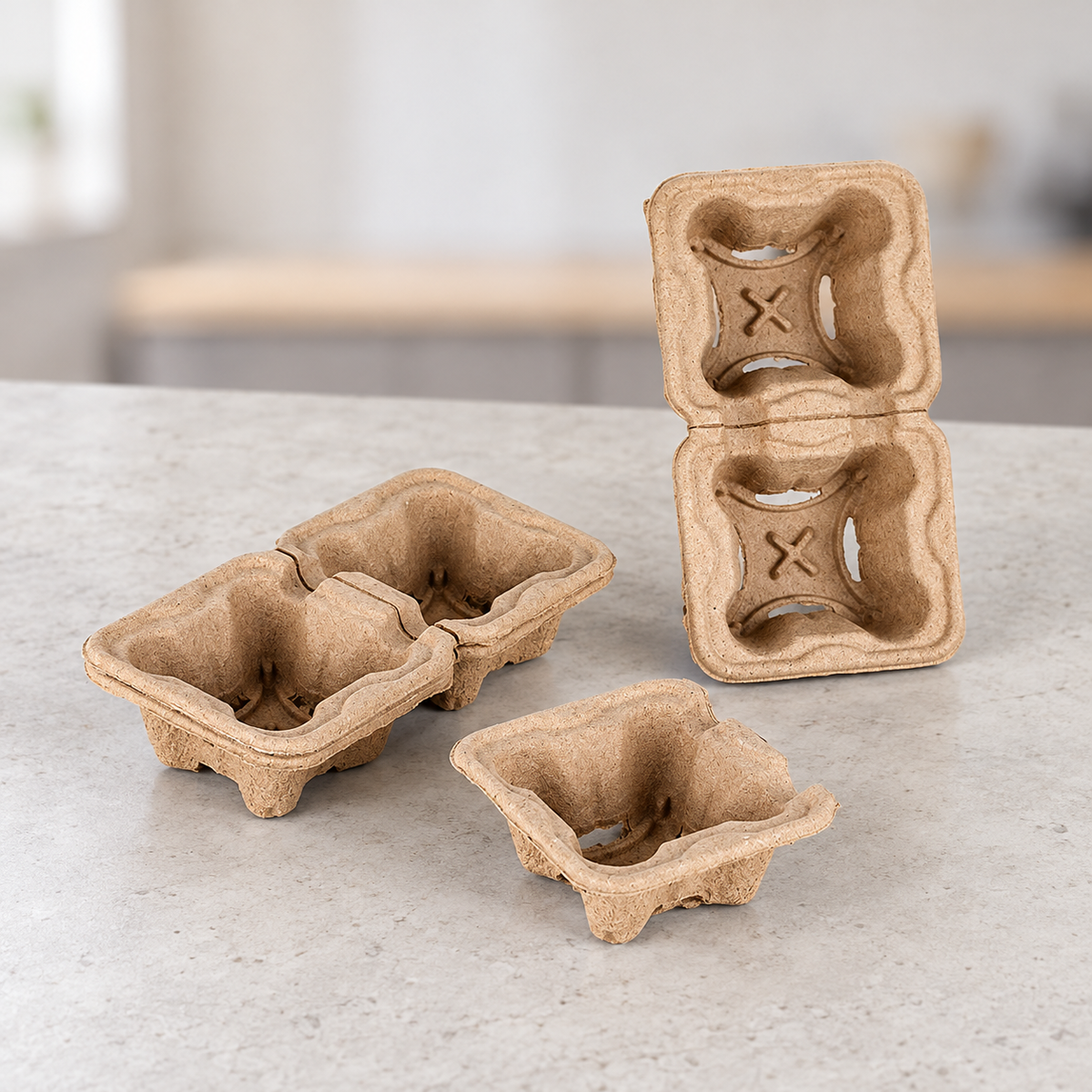 Two-cup tear-away molded pulp drink carrier shown intact and separated into a single-cup holder